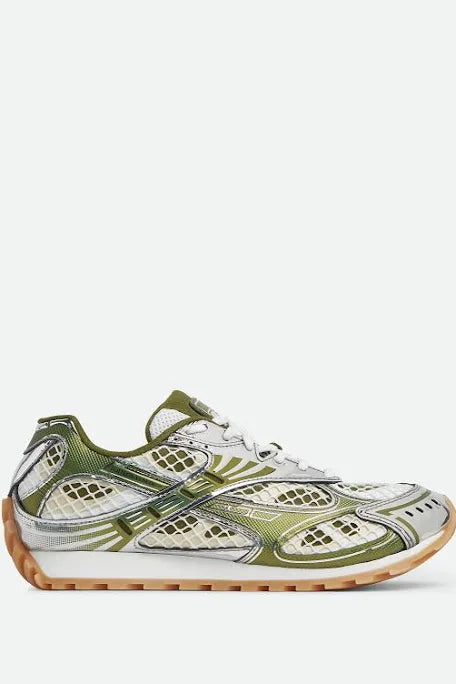 Olive green and silver mesh sneakers with a sporty design, featuring a gum sole and sleek, futuristic accents.