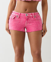 Woman wearing bright pink denim shorts with frayed hems, front button closure, and multiple pockets, shown from the front at mid-thigh.