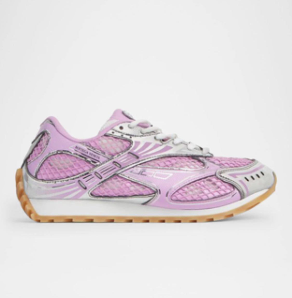 Pink and silver running shoes with mesh fabric, sleek design, and a light gum sole, offering both style and comfort for active wear.