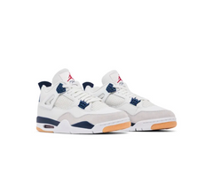 Pair of white Air Jordan sneakers with navy blue details, gum outsole, mesh side panels, and red Jumpman logo on tongues.