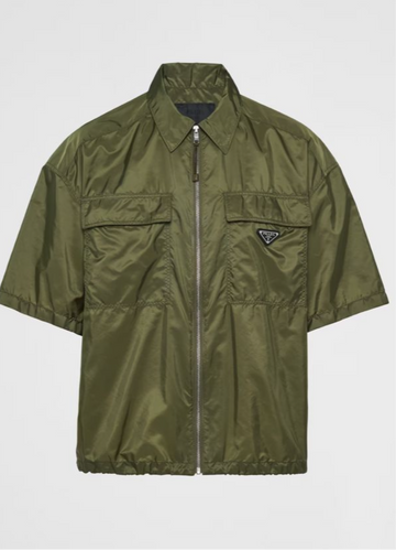 Olive green short-sleeve jacket with a front zipper and a small Prada logo on the chest.