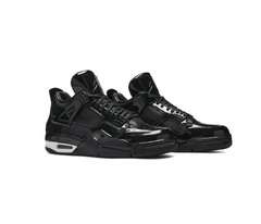 Glossy black Air Jordan 4 sneakers with patent leather finish, black mesh panels, and white air sole unit accents shown side view.