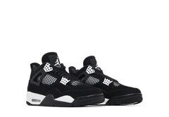 Pair of black and white Air Jordan 4 sneakers with mesh panels, black laces, and white sole accents on a white background.