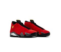 Air Jordan 14 Retro “Ferrari” sneakers in red suede with black soles, carbon fiber accents, and yellow Jumpman shield logo on sides.