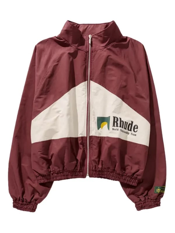 Maroon Rhude zip-up jacket with white diagonal panel, green and yellow logo, “World Championship Team” text, and elastic cuffs and hem.
