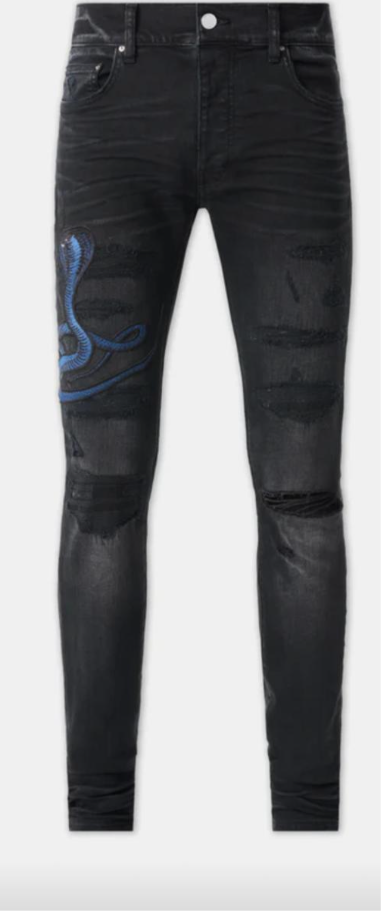 A pair of black distressed skinny jeans with rips on the thighs and a blue snake embroidered on the left leg.