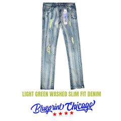 Light green washed slim-fit denim with distressed rips, faded wash, and a blue brand tag attached to the waistband.