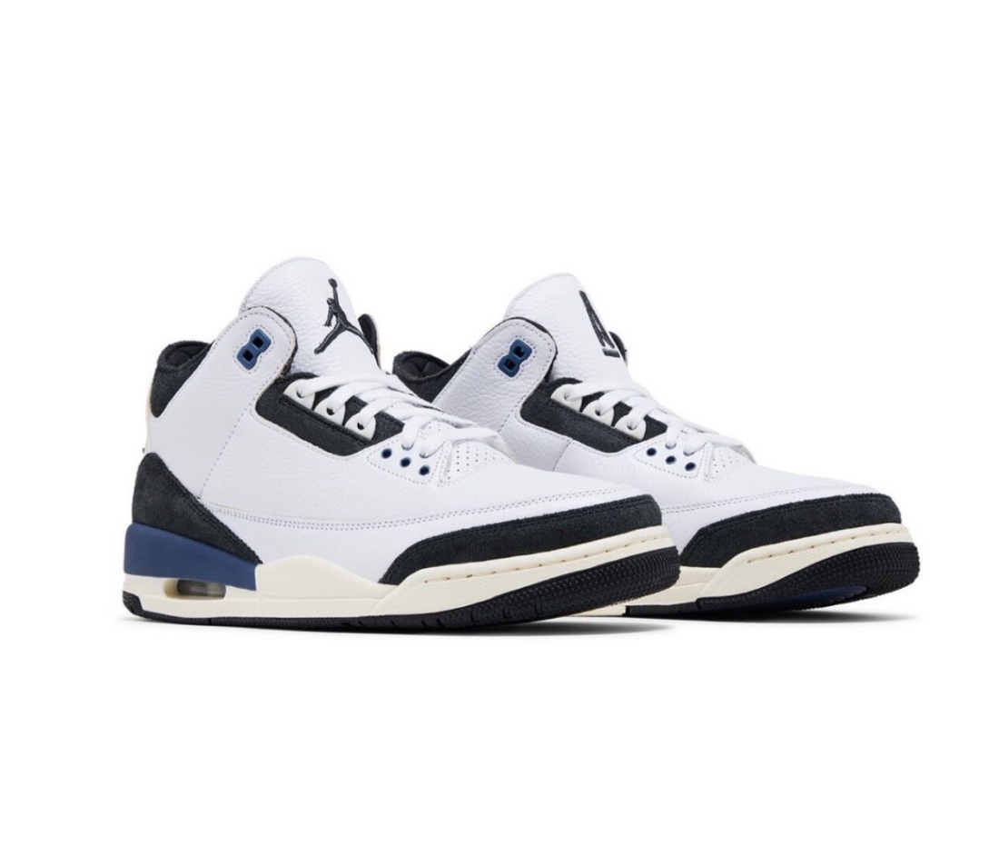 Pair of white and black Air Jordan sneakers with blue accents and visible air sole, photographed on a white background.