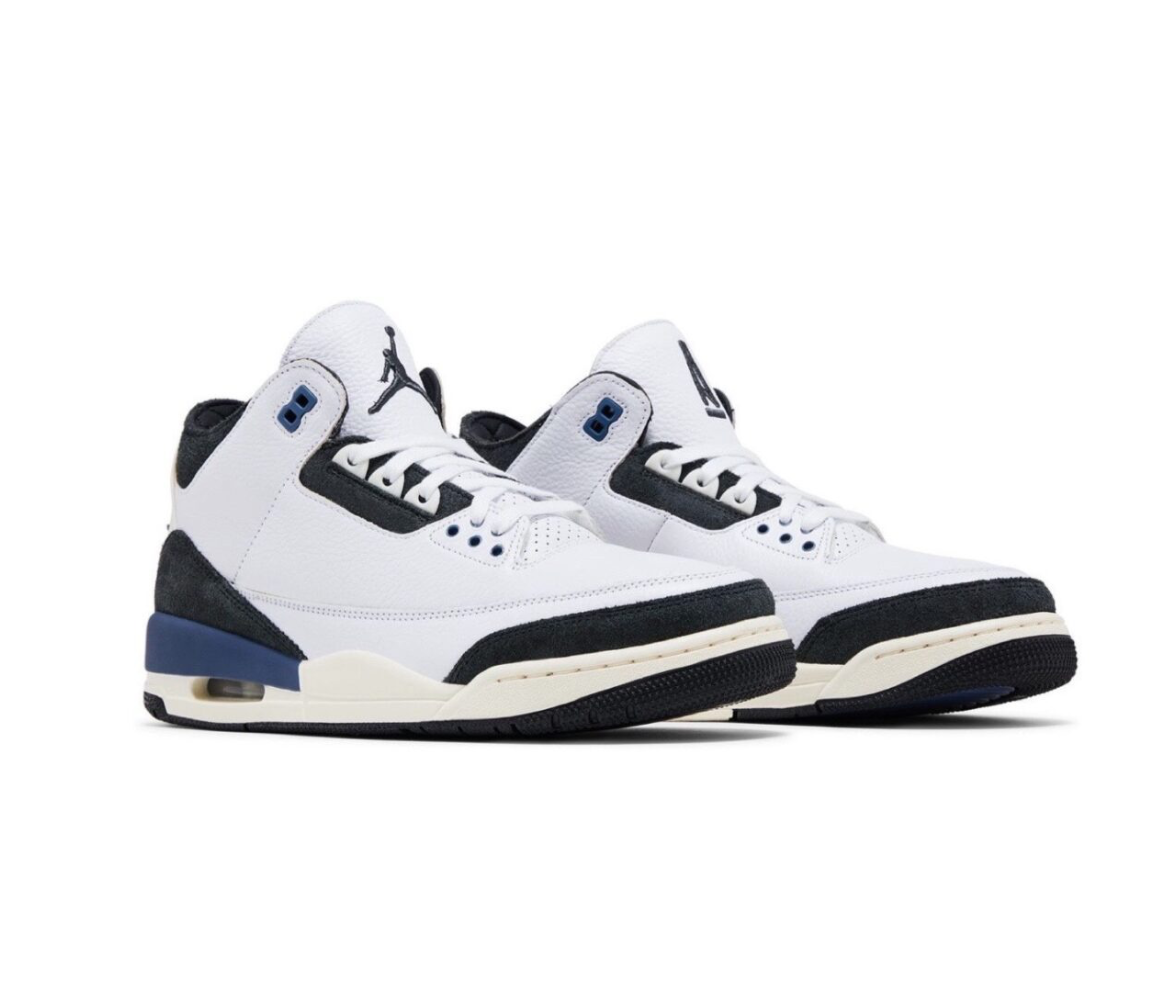Pair of white and black Air Jordan sneakers with blue accents and visible air sole, photographed on a white background.