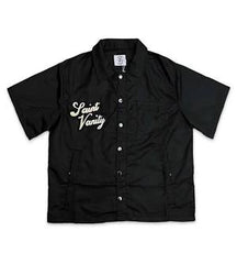 A black Saint Vanity short-sleeve button-up shirt with the brand logo embroidered on the left chest and two front pockets.