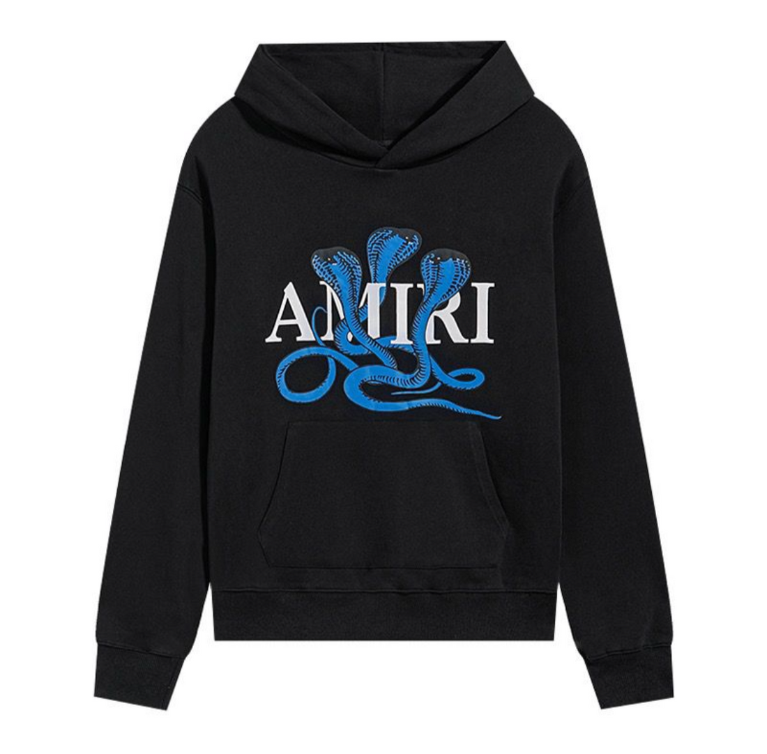 Black hoodie with a front kangaroo pocket featuring a blue three-headed cobra graphic over white "AMIRI" text logo.