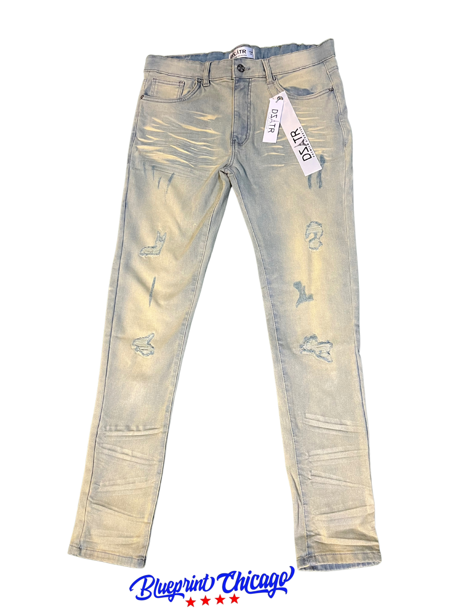 A pair of light blue distressed jeans with a faded design, featuring rips and a "DSATR" brand tag, displayed with a "Blueprint Chicago" label.