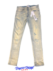 A pair of light blue distressed jeans with a faded design, featuring rips and a "DSATR" brand tag, displayed with a "Blueprint Chicago" label.