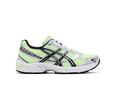 White and neon green mesh sneakers with silver and black accents, featuring a sleek design for athletic wear or casual style.