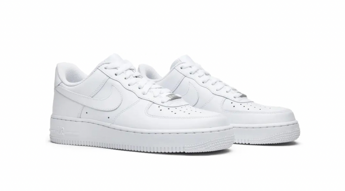 A pair of white Nike Air Force 1 sneakers with perforated toe, laces, and the signature swoosh logo on the sides.