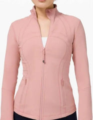 Woman wearing fitted light pink zip-up jacket with long sleeves and zip pockets, shown from front on white background.