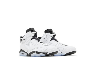 Pair of Air Jordan 6 sneakers in white and black colorway, featuring perforated leather upper and icy translucent rubber outsole.
