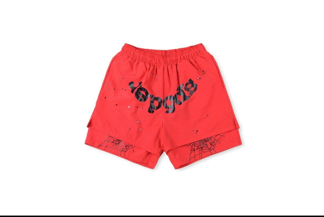 Red shorts featuring a bold "Yogos" print and spider web designs, perfect for a casual, streetwear-inspired look.
