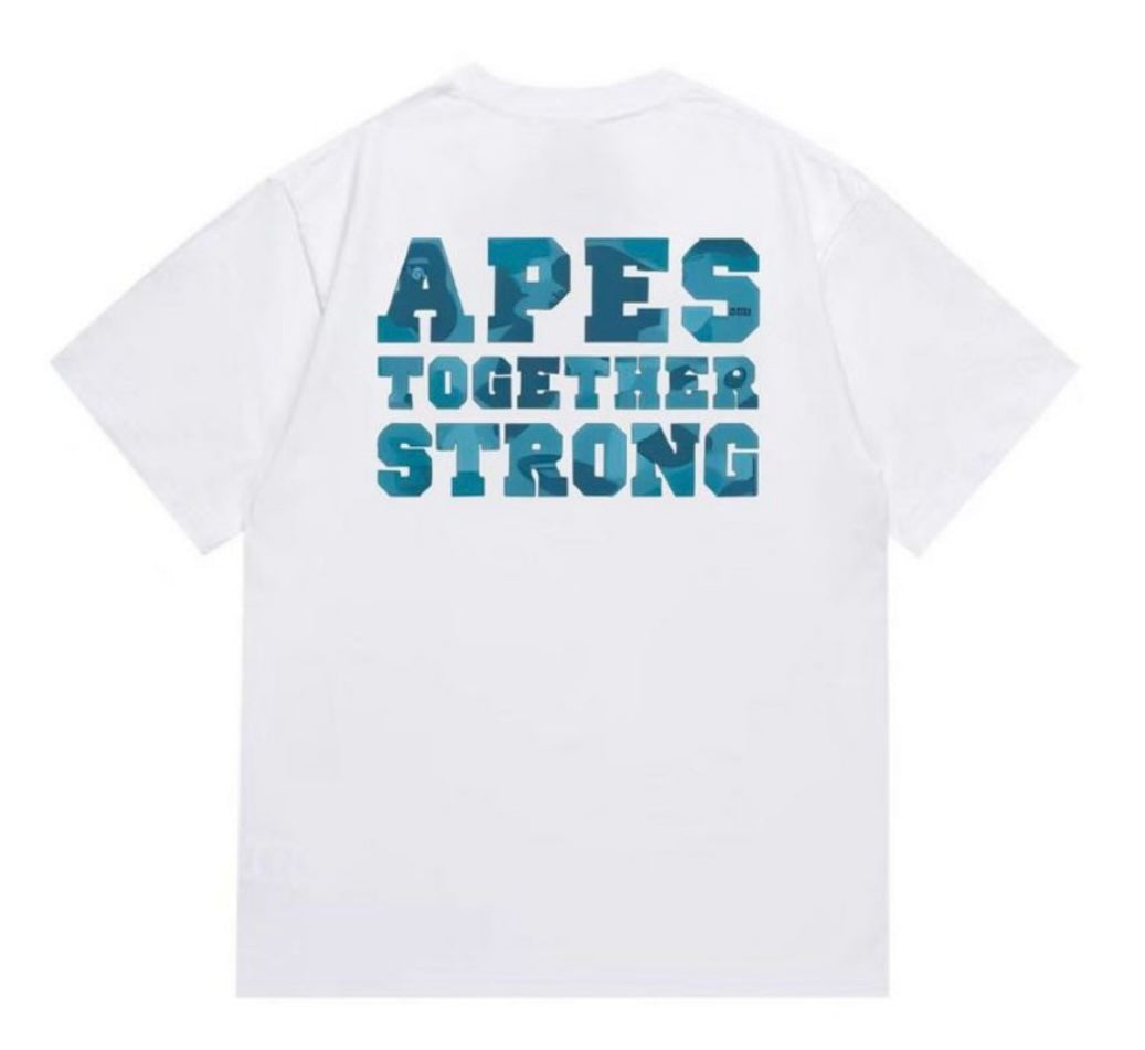 A white t-shirt featuring the phrase "APES TOGETHER STRONG" on the back, with the text in bold blue camouflage lettering.