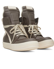 Brown leather high-top sneakers with beige laces and padding, featuring a sleek design for an athletic yet stylish look.