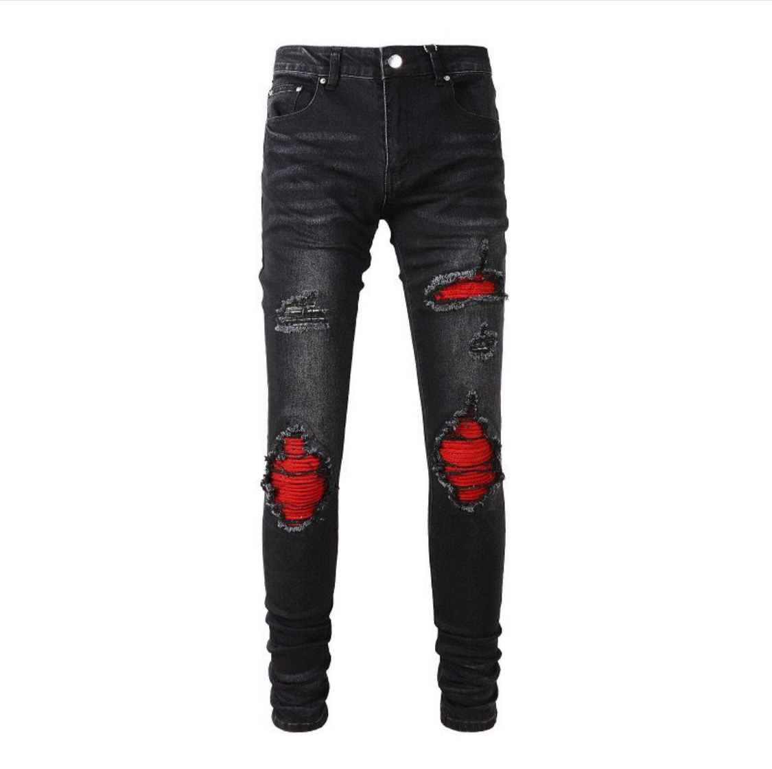 Black ripped skinny jeans with red fabric showing through large distressed patches on front, displayed on white background.