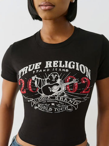 Woman wearing a black crop top with “True Religion 2002 Buddha Brand World Tour” graphic featuring a guitar-playing Buddha design.