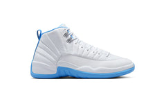 White Air Jordan 12 sneaker with textured leather upper, blue accents on midsole and lining, silver eyelets, and stitched panel detailing.