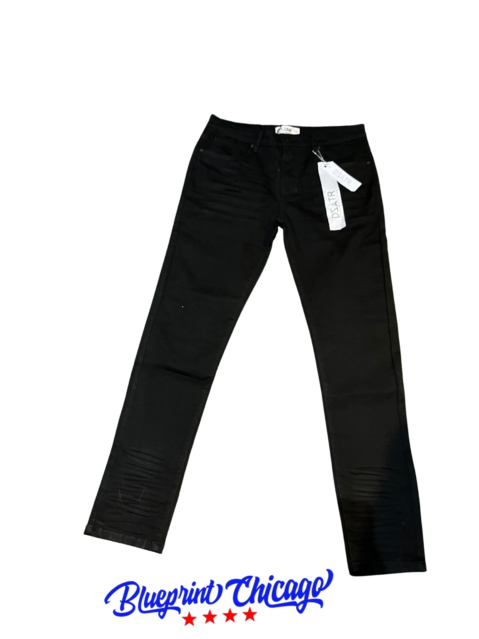 A pair of black skinny jeans with subtle distressed details on the thighs, price tags attached, and the "Blueprint Chicago" logo below.