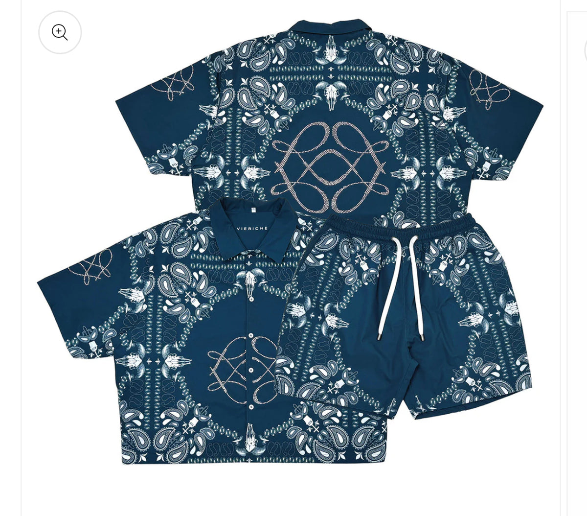 A blue matching shirt and shorts set featuring intricate white paisley and skull designs with a drawstring on the shorts.