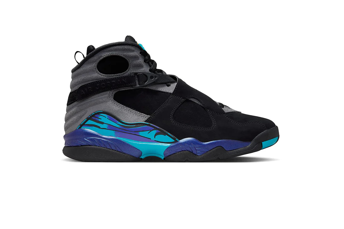 A pair of Air Jordan 8 sneakers featuring a black, grey, and purple colorway with a unique design on the midsole and turquoise accents.
