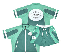 Mint green and dark teal short sleeve zip jacket with matching shorts, featuring white RICHE logos and zippered pockets.