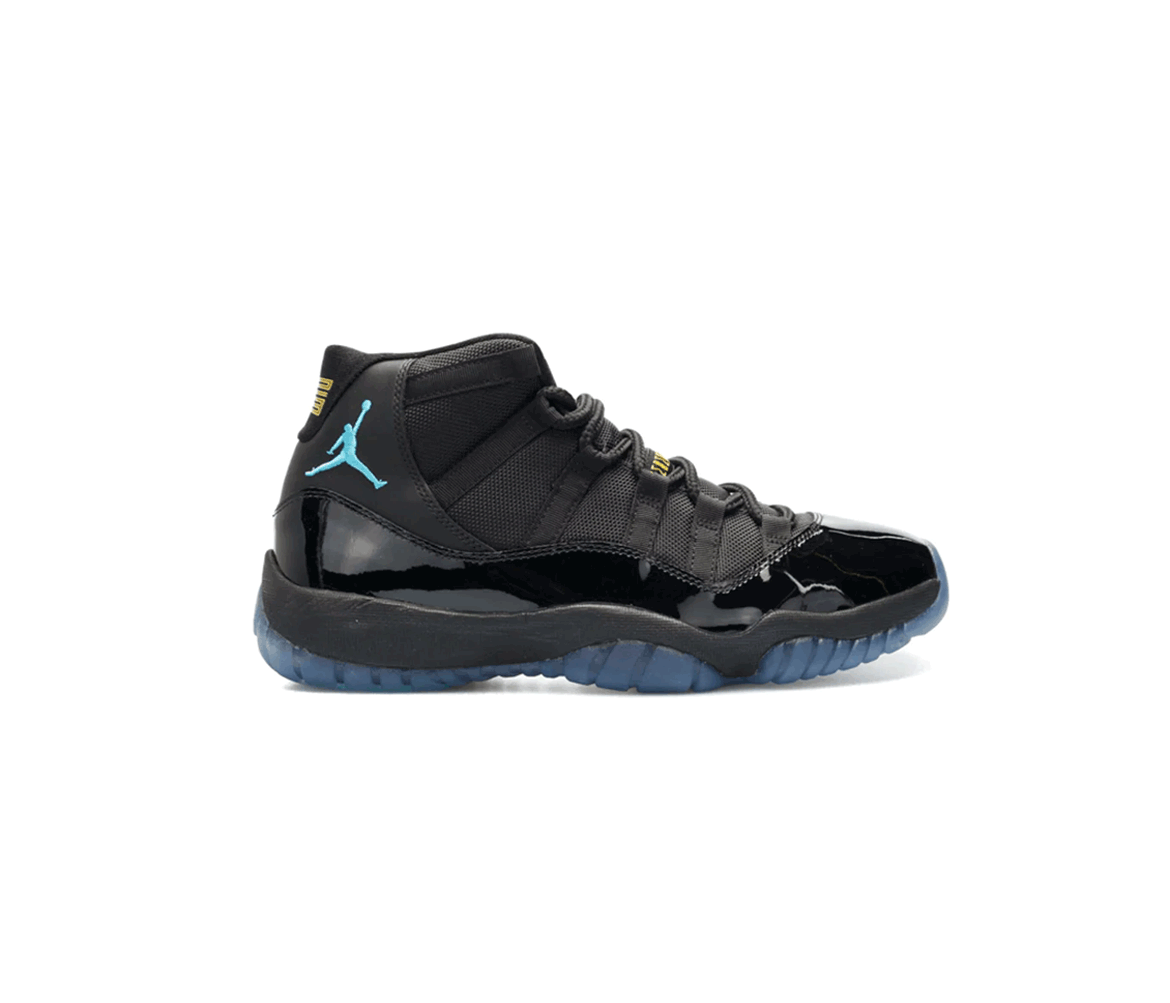 Black and blue Air Jordan 11 sneaker with patent leather details, blue Jumpman logo, and translucent blue sole on white background.