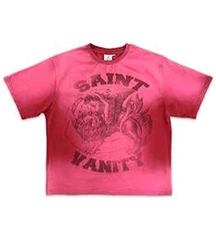 Pink short-sleeve T-shirt with faded black graphic design featuring the text "SAINT VANITY" across the chest area.