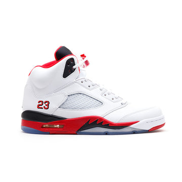White Air Jordan 5 sneaker with red, black accents, translucent sole, mesh side panel, "23" embroidered in red on heel.